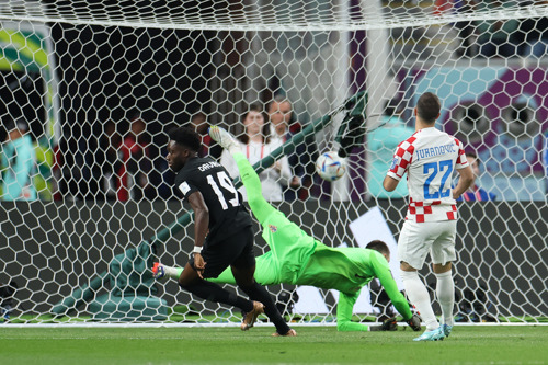 Alphonso Davies of Canada celebrates after scoring their team's first goal during the FIFA World Cup Qatar 2022 Group F match between Croatia and Canada at Khalifa International Stadium on November 27, 2022 in Doha, Qatar